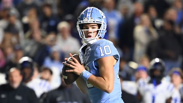 Nov 11, 2023; Chapel Hill, North Carolina, USA; DUPLICATE***North Carolina Tar Heels quarterback Drake Maye (10)***North Carolina Tar Heels defensive lineman Desmond Evans (10) looks to pass in the second quarter at Kenan Memorial Stadium.